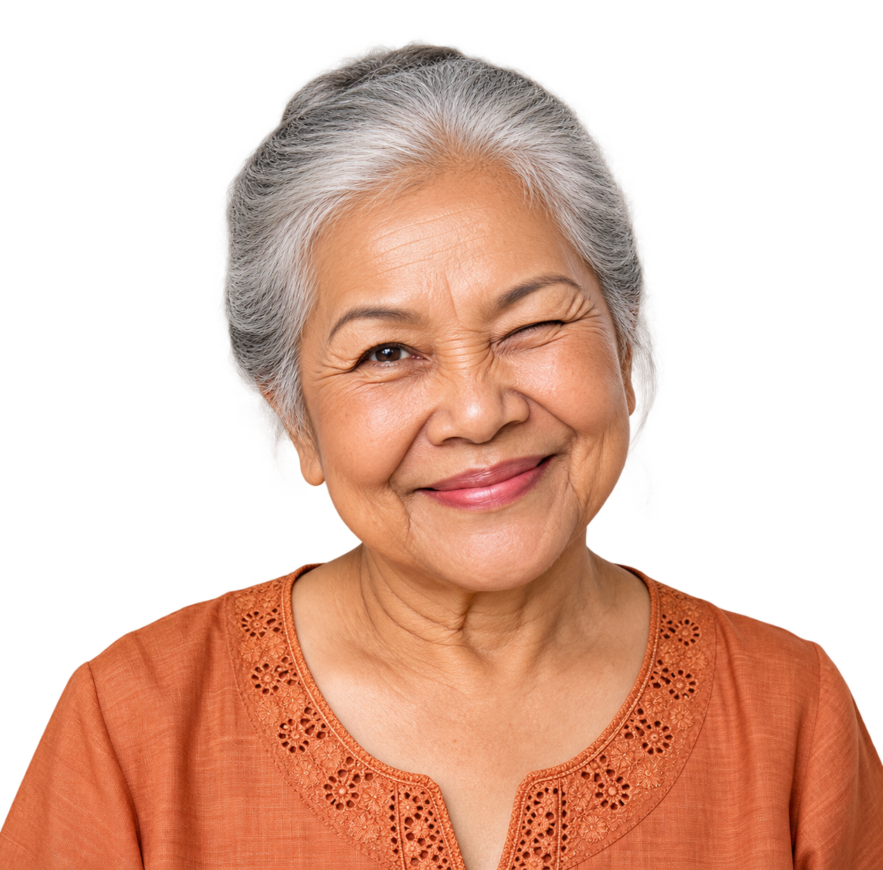 Lächelnde ältere Thai Frau, die zwinkert
